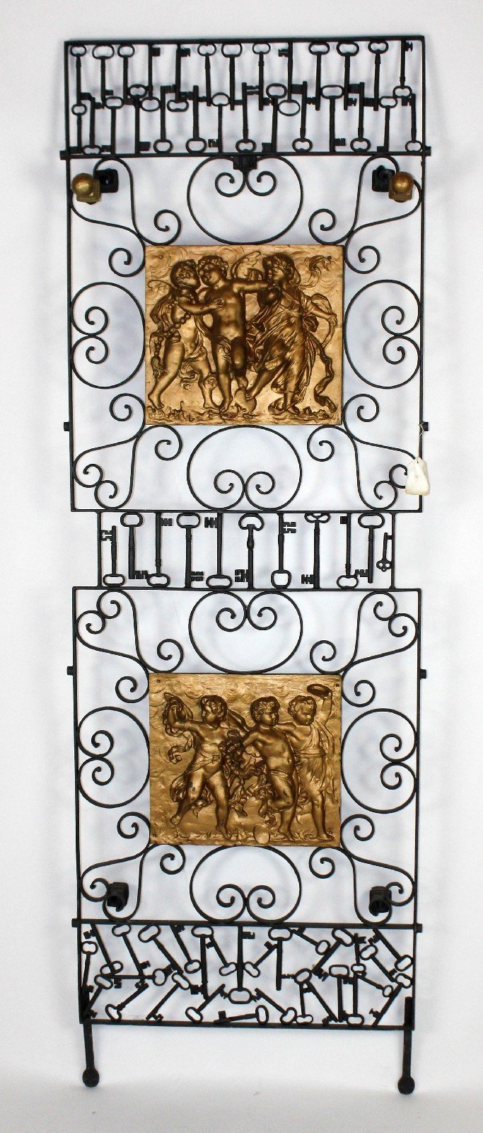 Antique French scrolled iron panel with relied cherubs