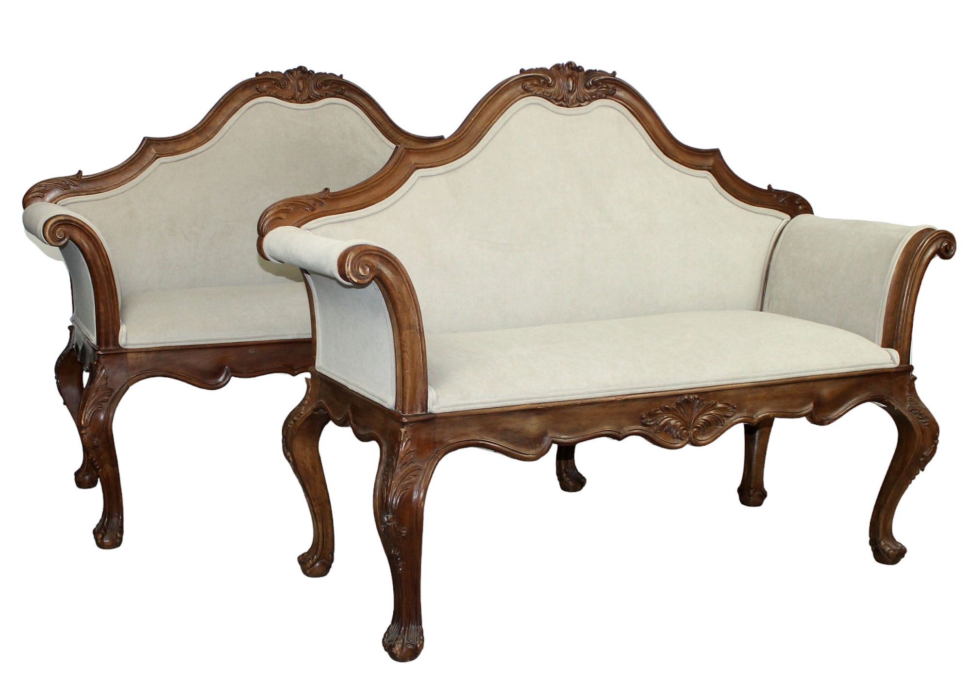 Pair of French Louis XV carved walnut settees